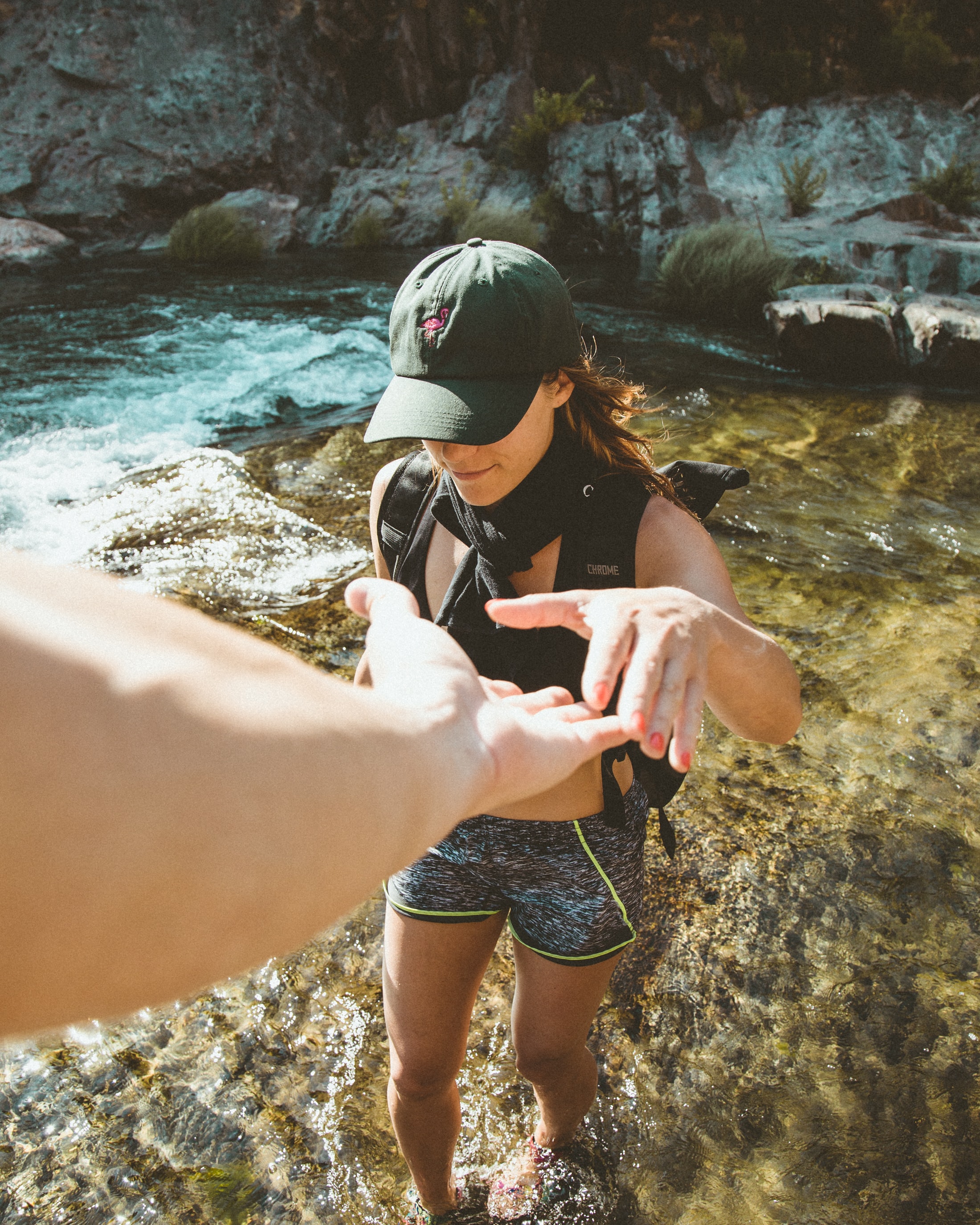 Woman crossing river