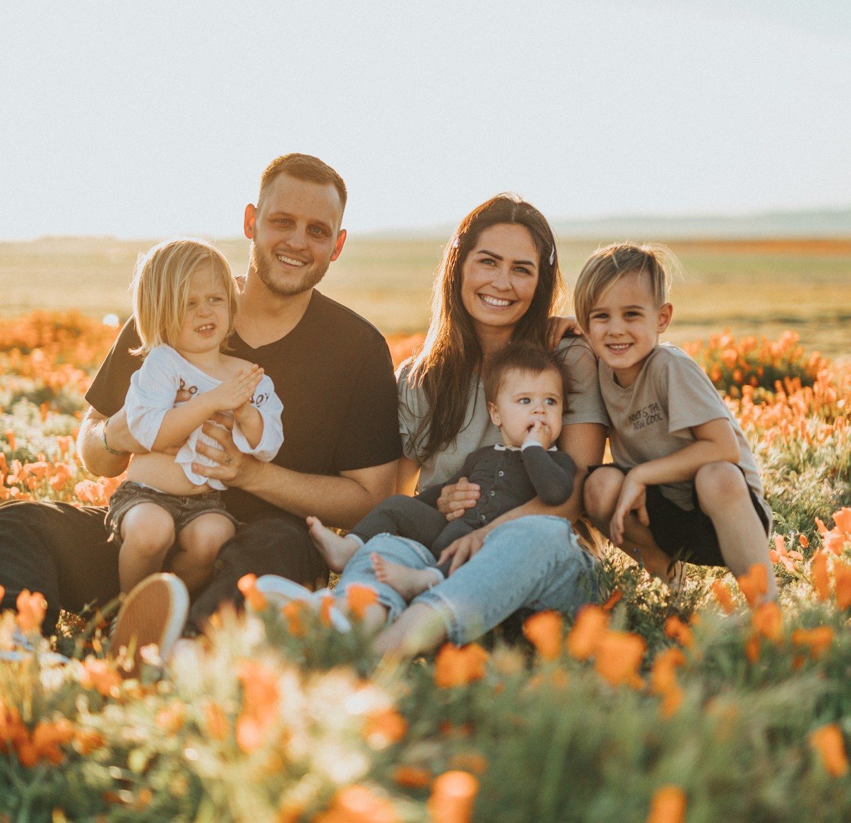 Family in flied of flowers