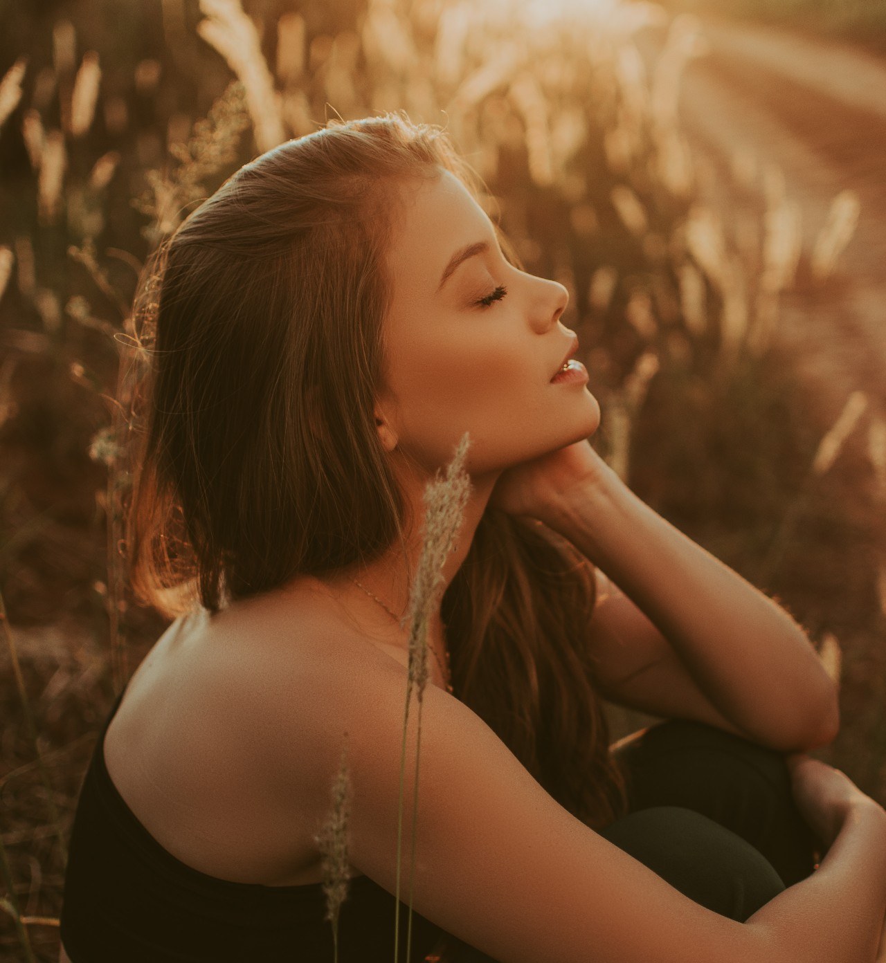 Woman in nature closed eyes